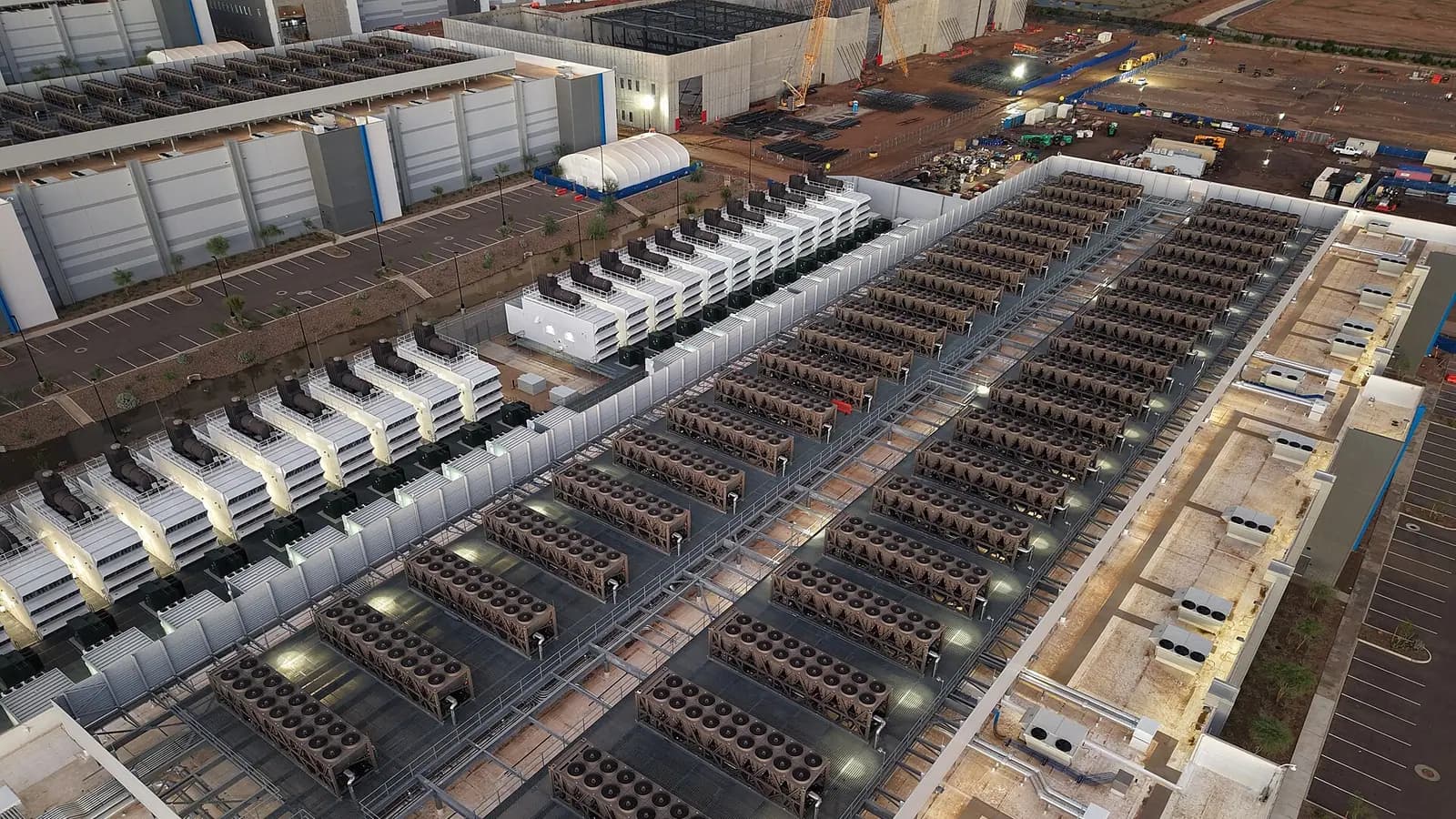 Roof of a data center featuring cooling towers and backup generators.